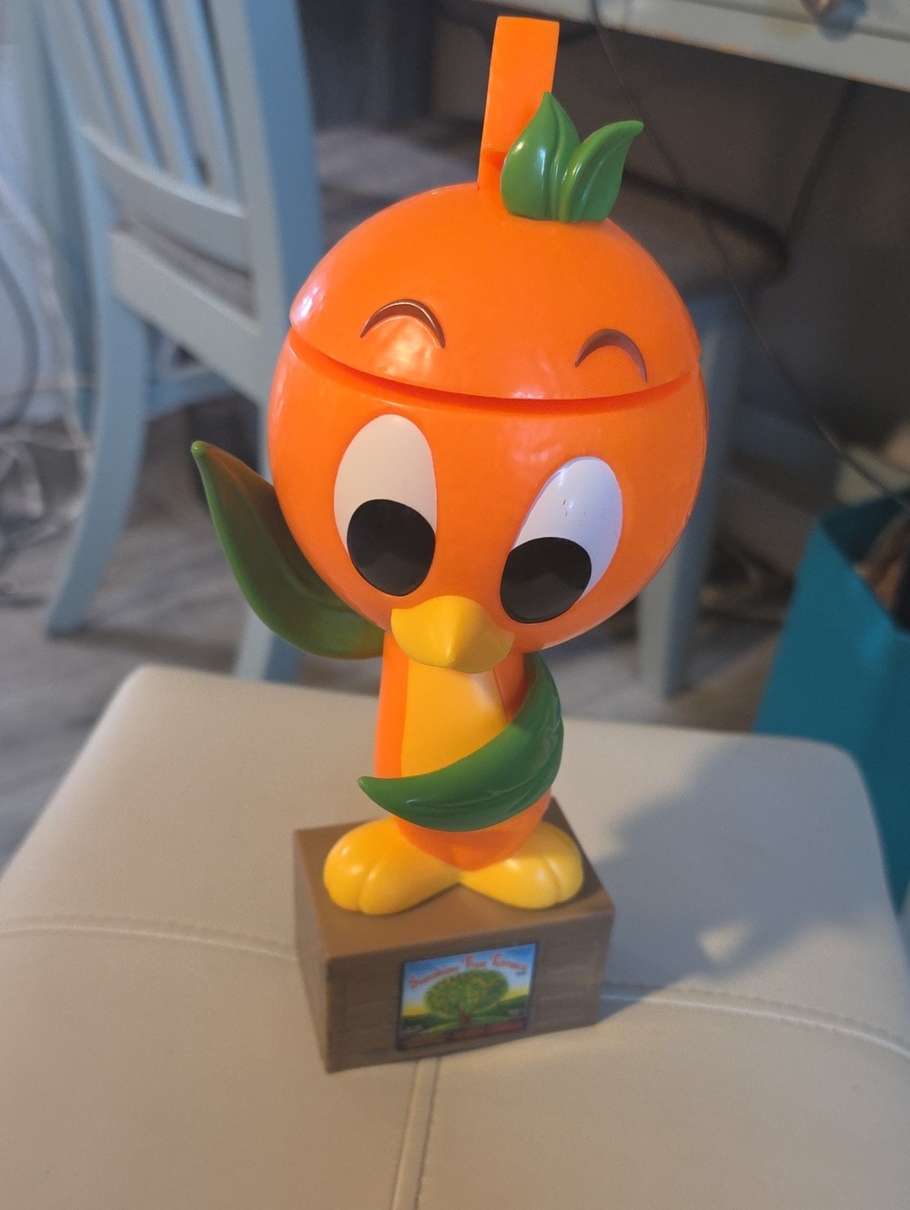 Disney Orange Bird Character Figure with Green Leaf Accents
